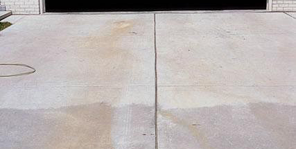 Discoloration of a slab with the darker area having the calcium chloride additive while the area closer to the door did not.